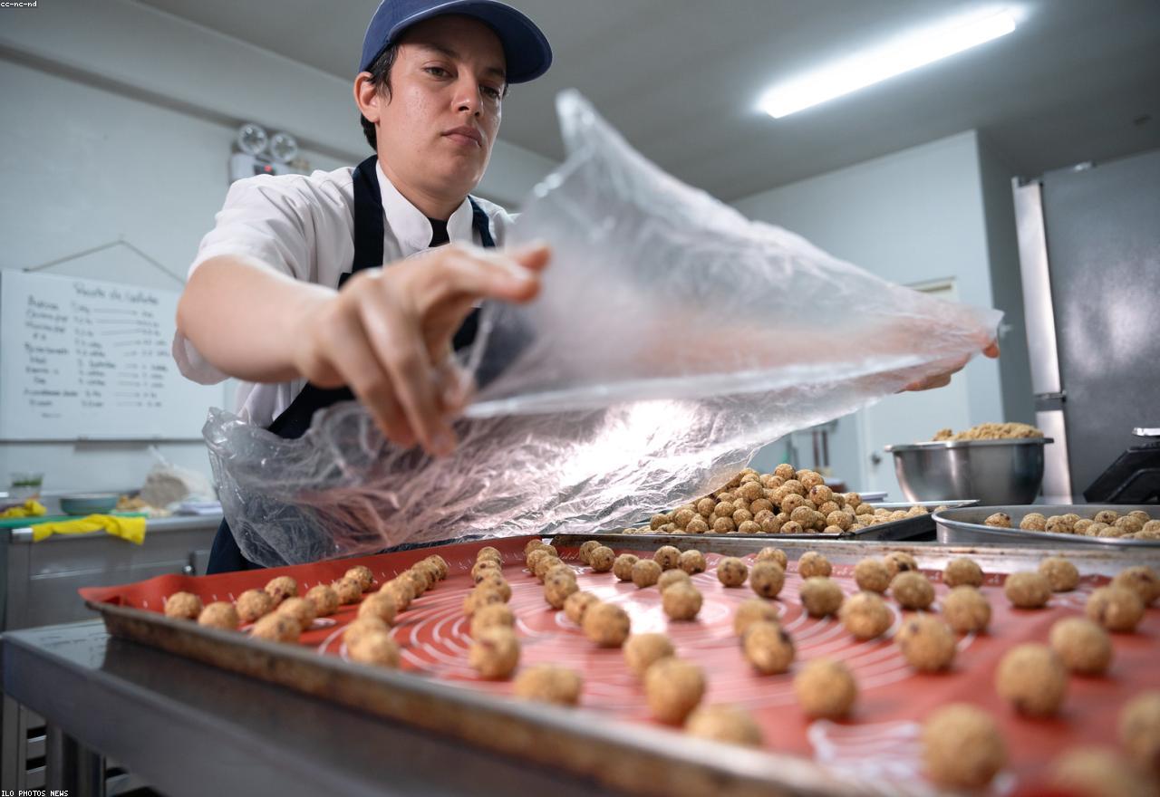 A warm bakery team at work behind the counter